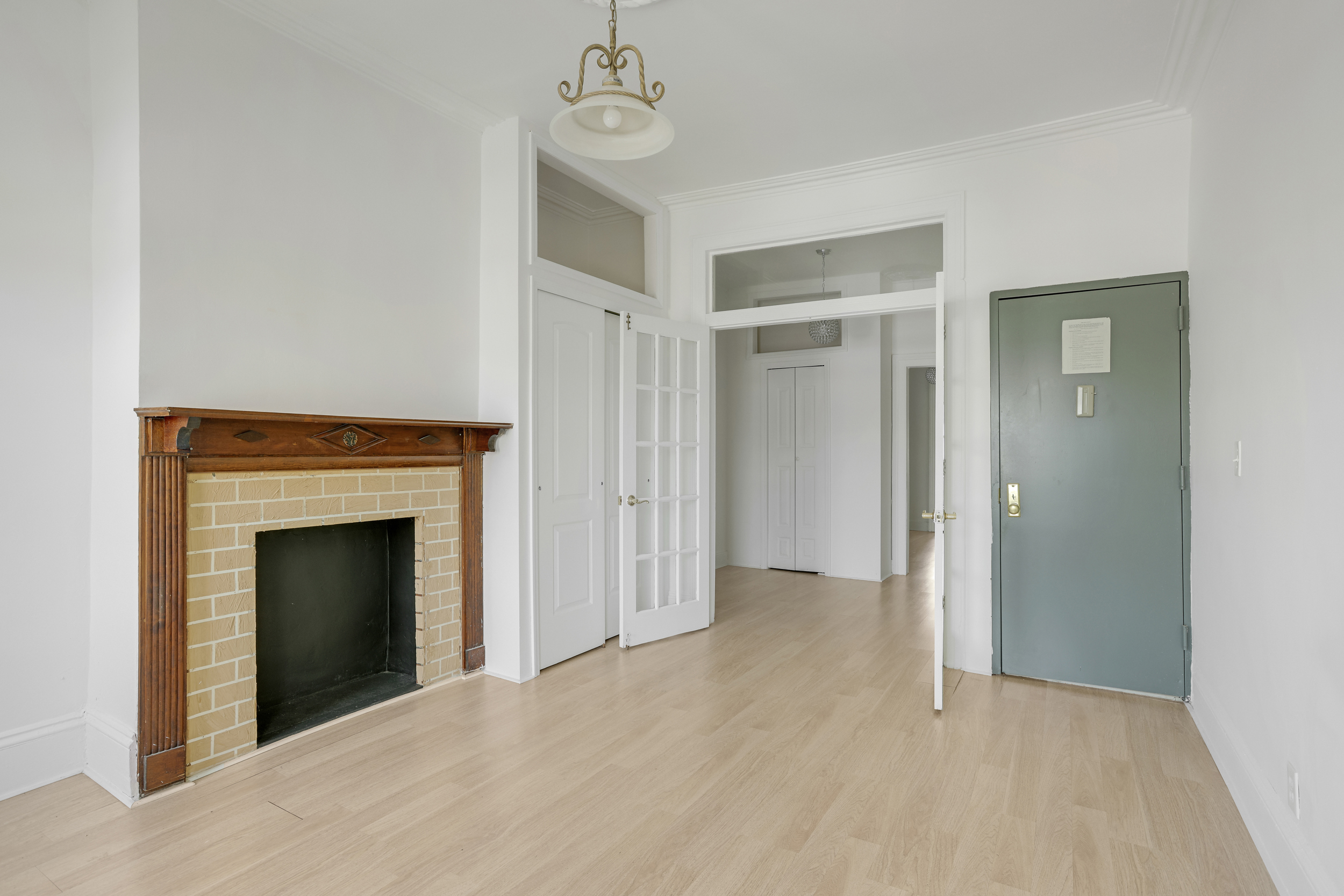 100 Powers Street, Unit 3L Brooklyn, NY 11211 - Photo 6 of 17 a view of an empty room with a fireplace