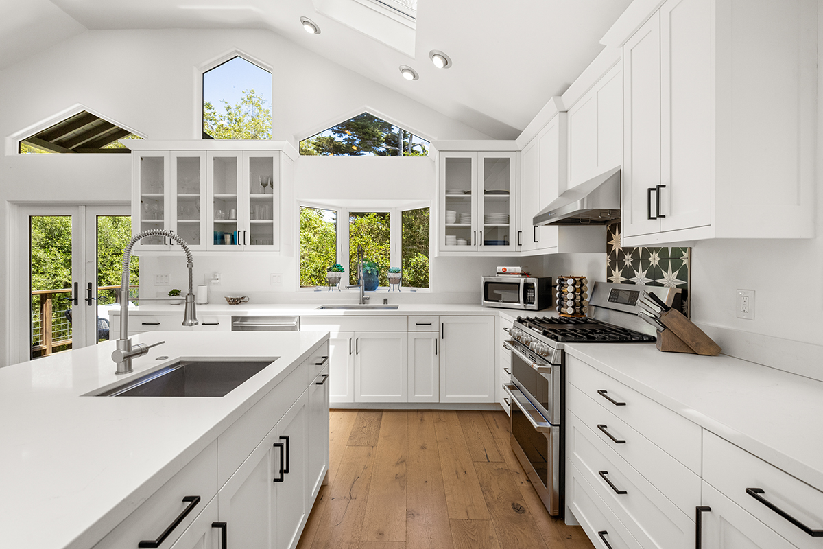 161 Loureyro Road Montecito, CA 93108 - Photo 8 of 52 a kitchen with a sink stove and cabinets