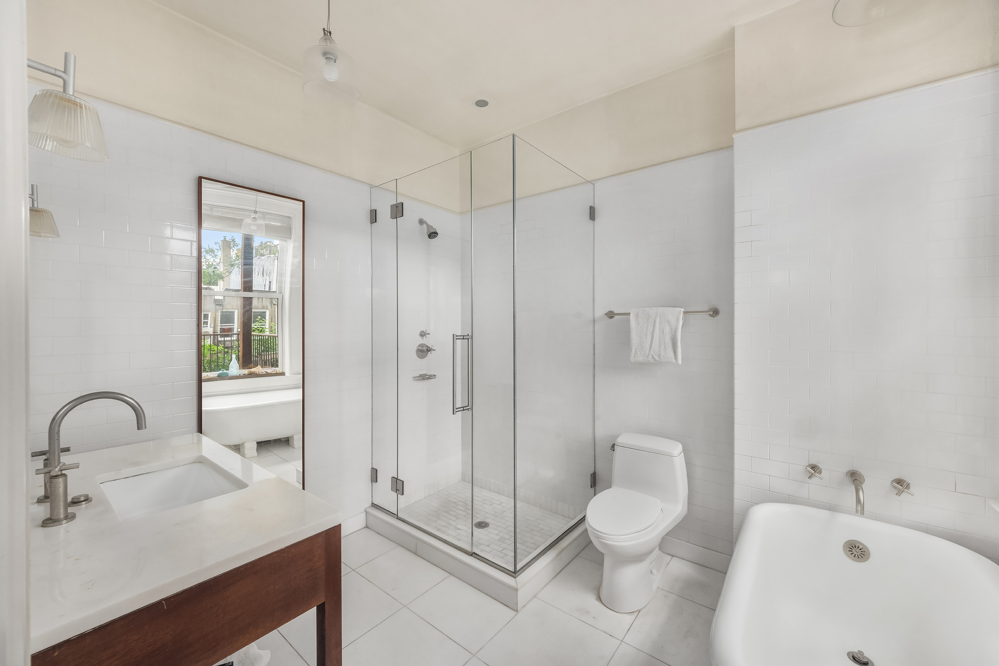128 State Street, Unit 2 Brooklyn, NY 11201 - Photo 11 of 15 a bathroom with a sink toilet and shower