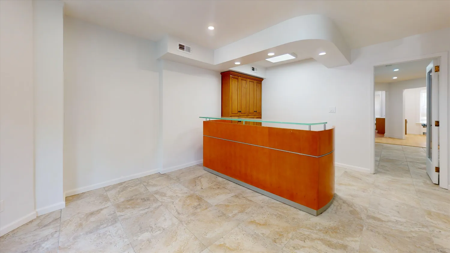 a bedroom with a bed and cabinet