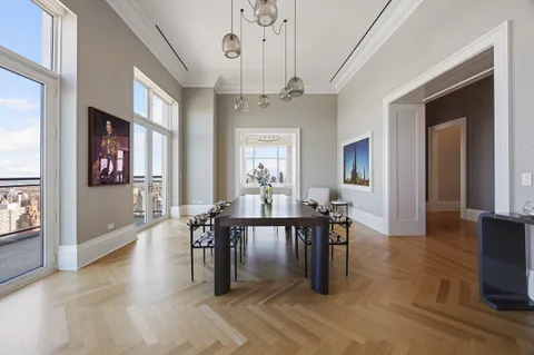an open kitchen with dining table and chairs