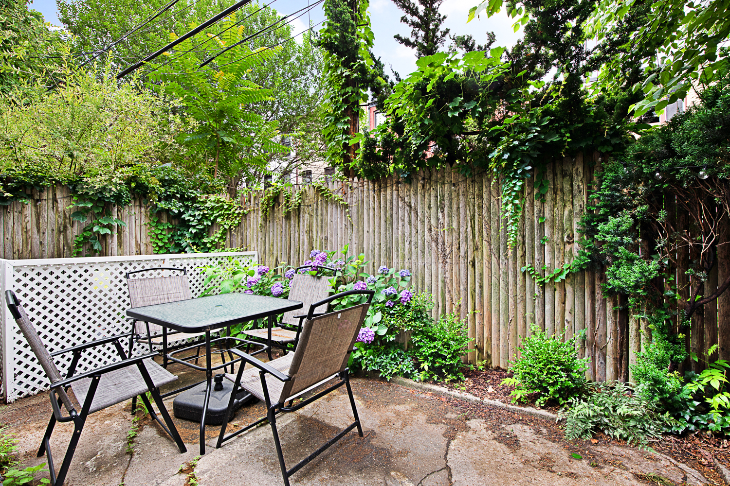 392 9th Street Brooklyn, NY 11215 - Photo 5 of 11 a table and chairs in a backyard of a house