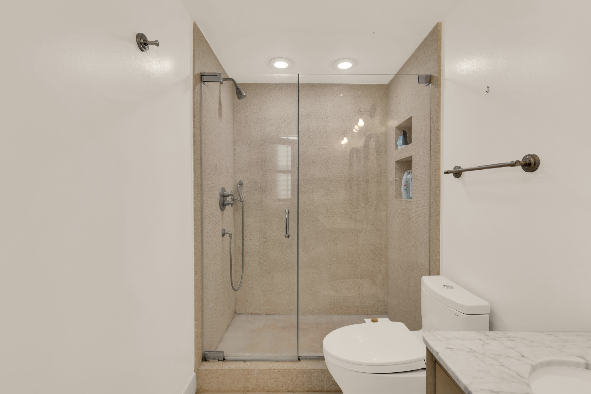 2127 California Street Northwest, Unit 505 Washington, DC 20008 - Photo 33 of 40 a bathroom with a shower a toilet and sink