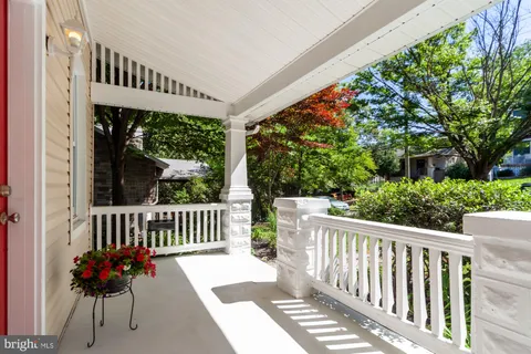 a view of a two chairs with table in balcony