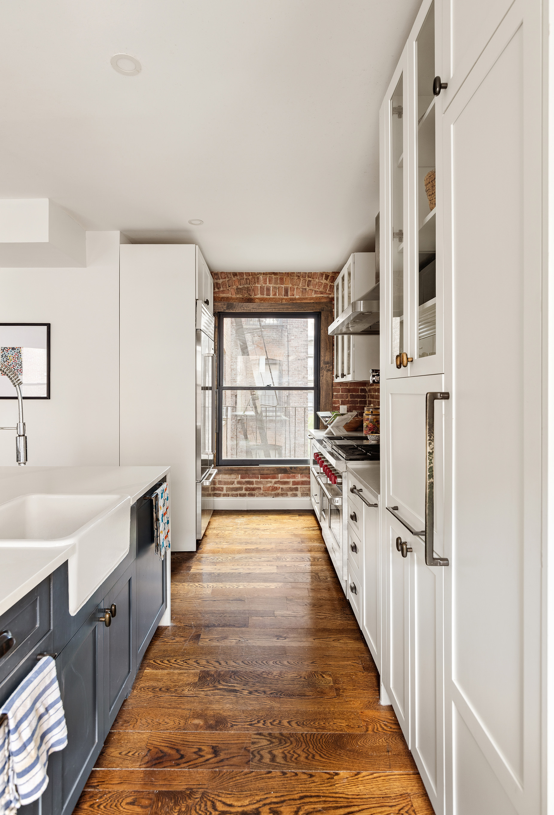 311 West 97th Street, Unit 5N Manhattan, NY 10025 - Photo 5 of 16 a kitchen with stainless steel appliances a refrigerator and a sink
