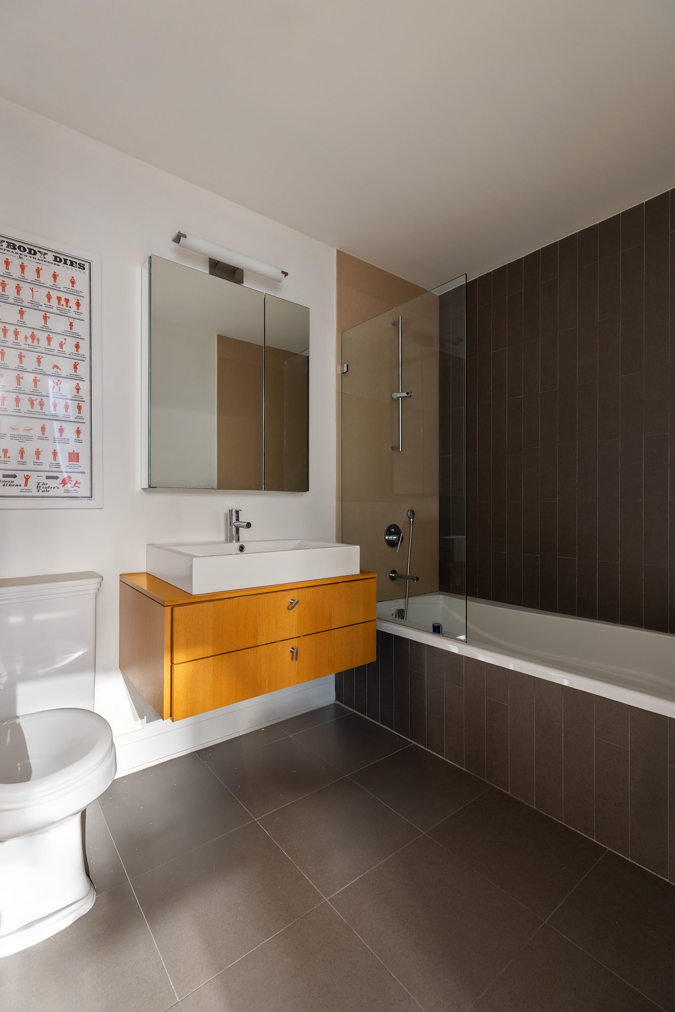 124 West 24th Street, Unit 4A Manhattan, NY 10011 - Photo 7 of 13 a bathroom with a large tub a sink and a large mirror