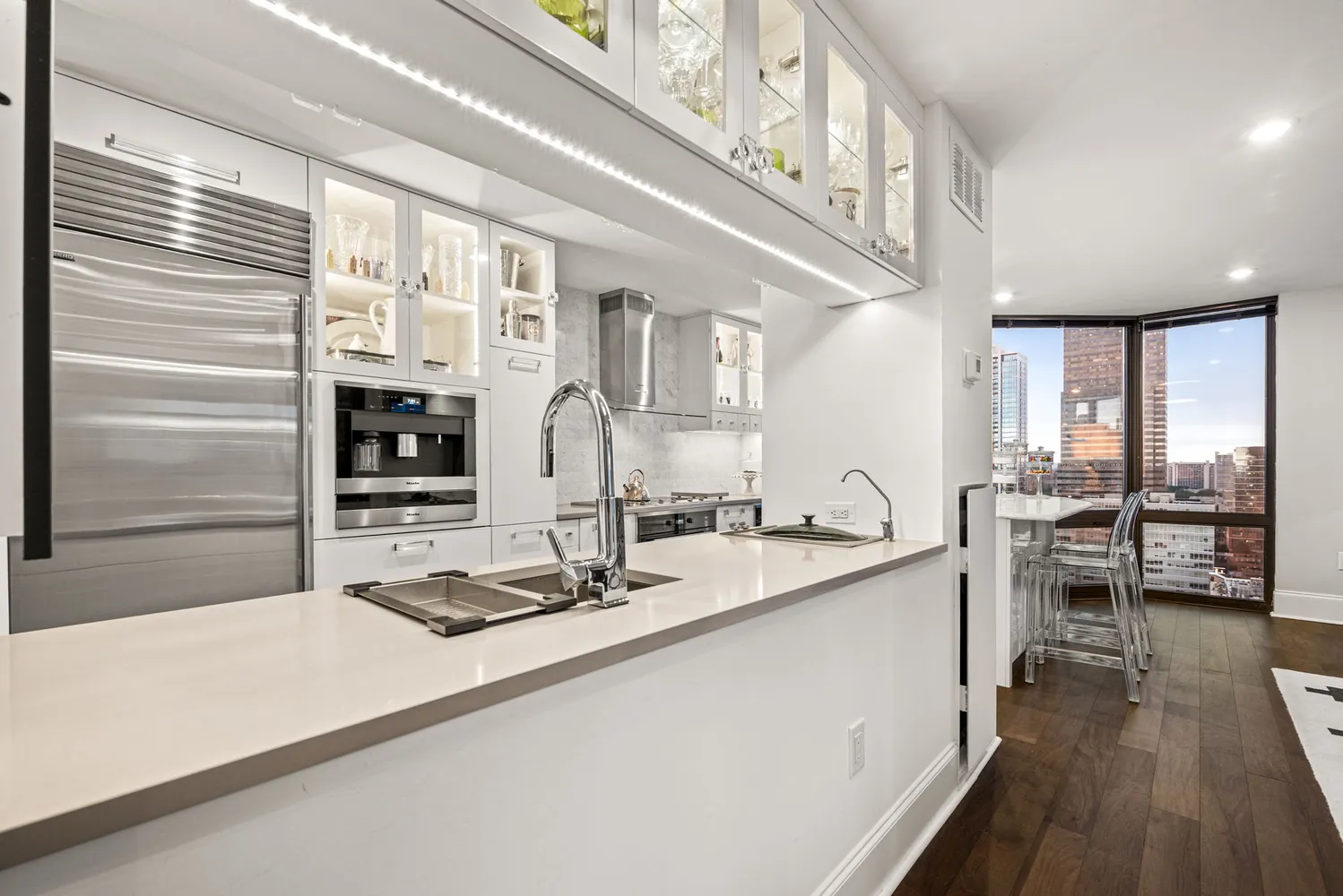 a kitchen with stainless steel appliances granite countertop a sink and cabinets