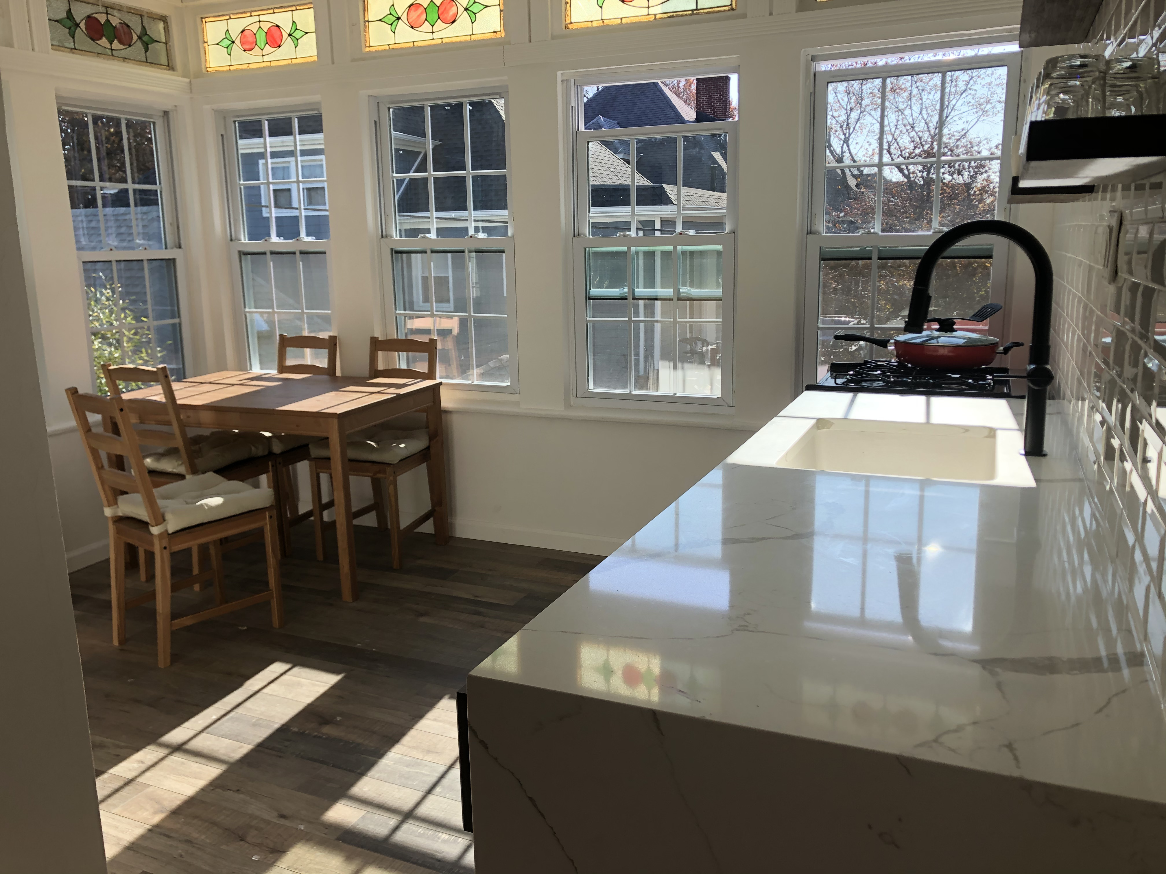 1112 Beverley Road Brooklyn, NY 11218 - Photo 22 of 53 a kitchen with a table chairs and a stove