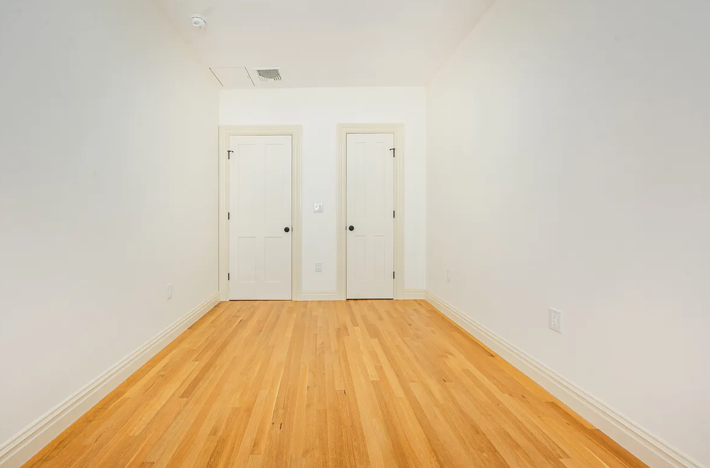 68-38 Forest Avenue, Unit 3R Queens, NY 11385 - Photo 13 of 15 a view of a room with wooden floor