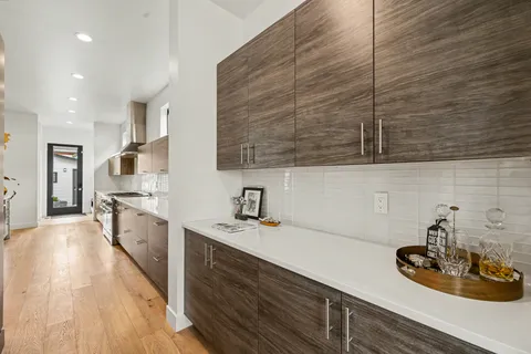 a kitchen with a sink stove and cabinets