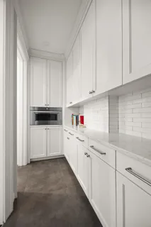 a kitchen with a sink cabinets and window