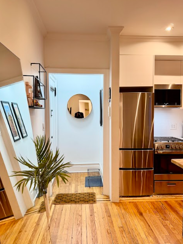 223 East 50th Street, Unit 1C Manhattan, NY 10022 - Photo 6 of 10 a view of a living room with a balcony
