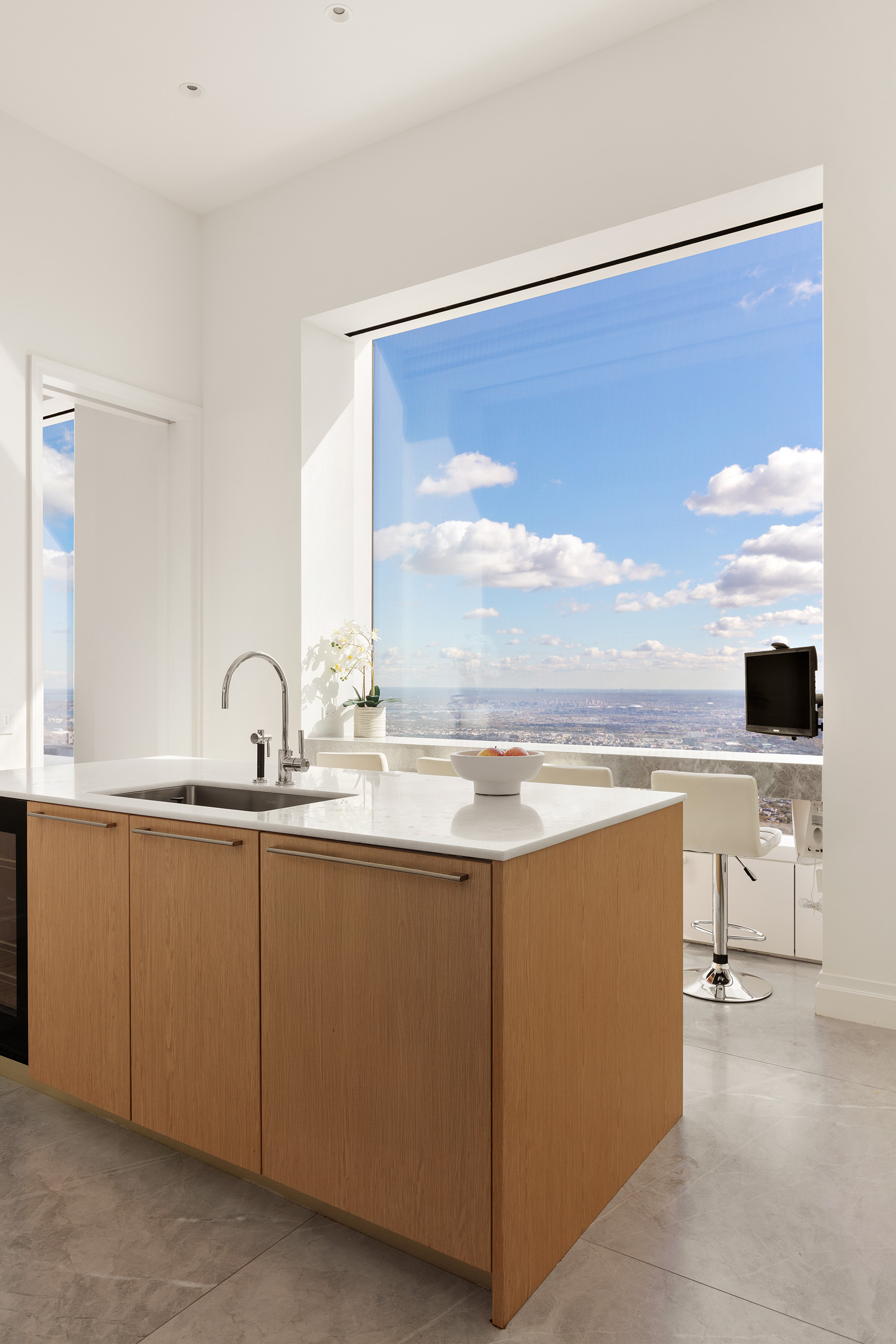 432 Park Avenue, Unit 81A Manhattan, NY 10022 - Photo 6 of 12 a view of kitchen with sink and wooden floor