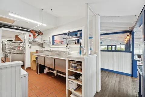 a room with cabinets and chair