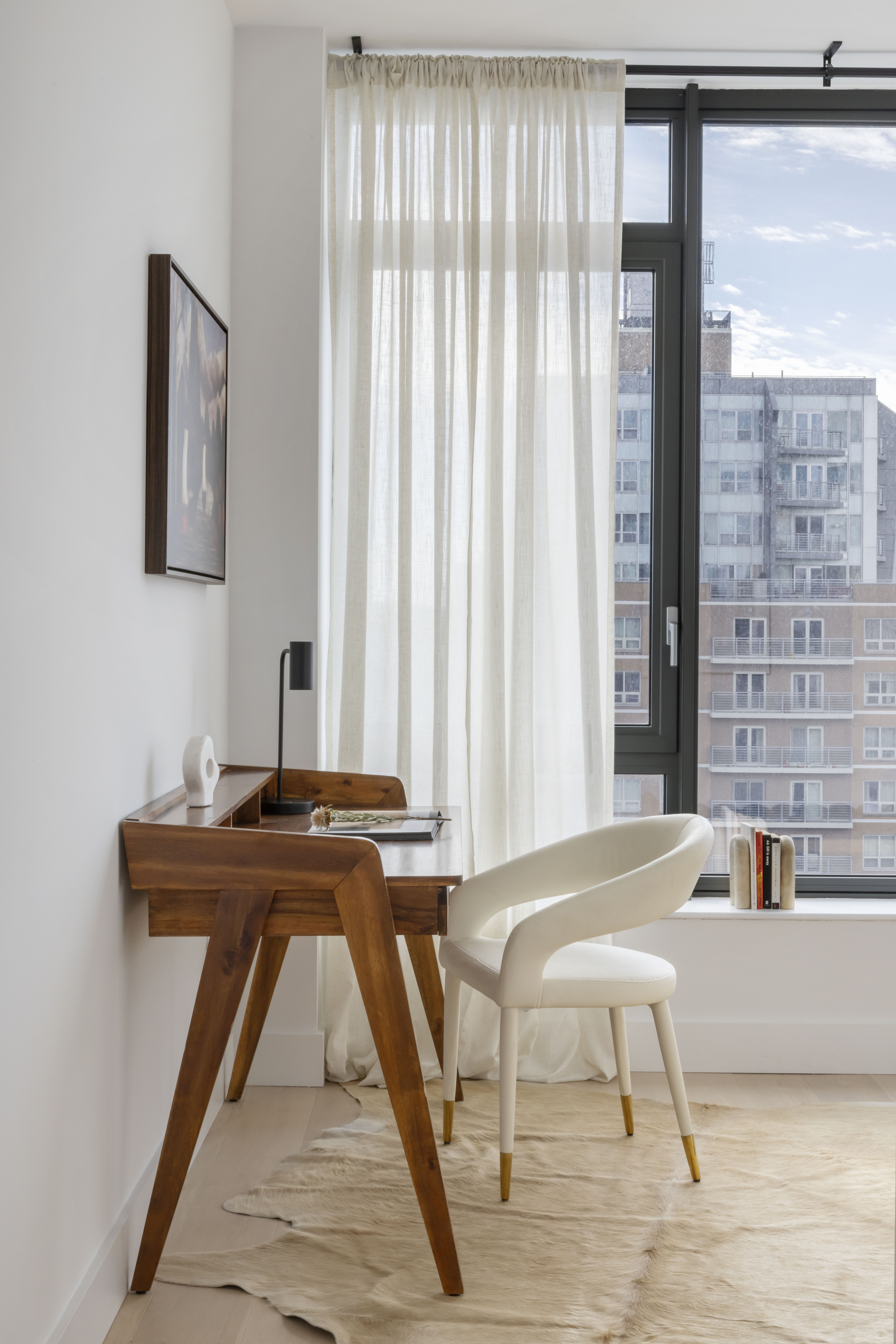 251 1st Street, Unit PH8D Brooklyn, NY 11215 - Photo 10 of 14 a living room with a table and a fireplace