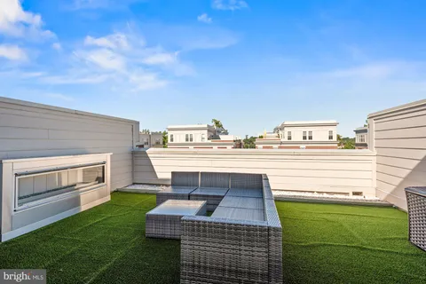 a view of a livingroom with furniture and a flat screen tv