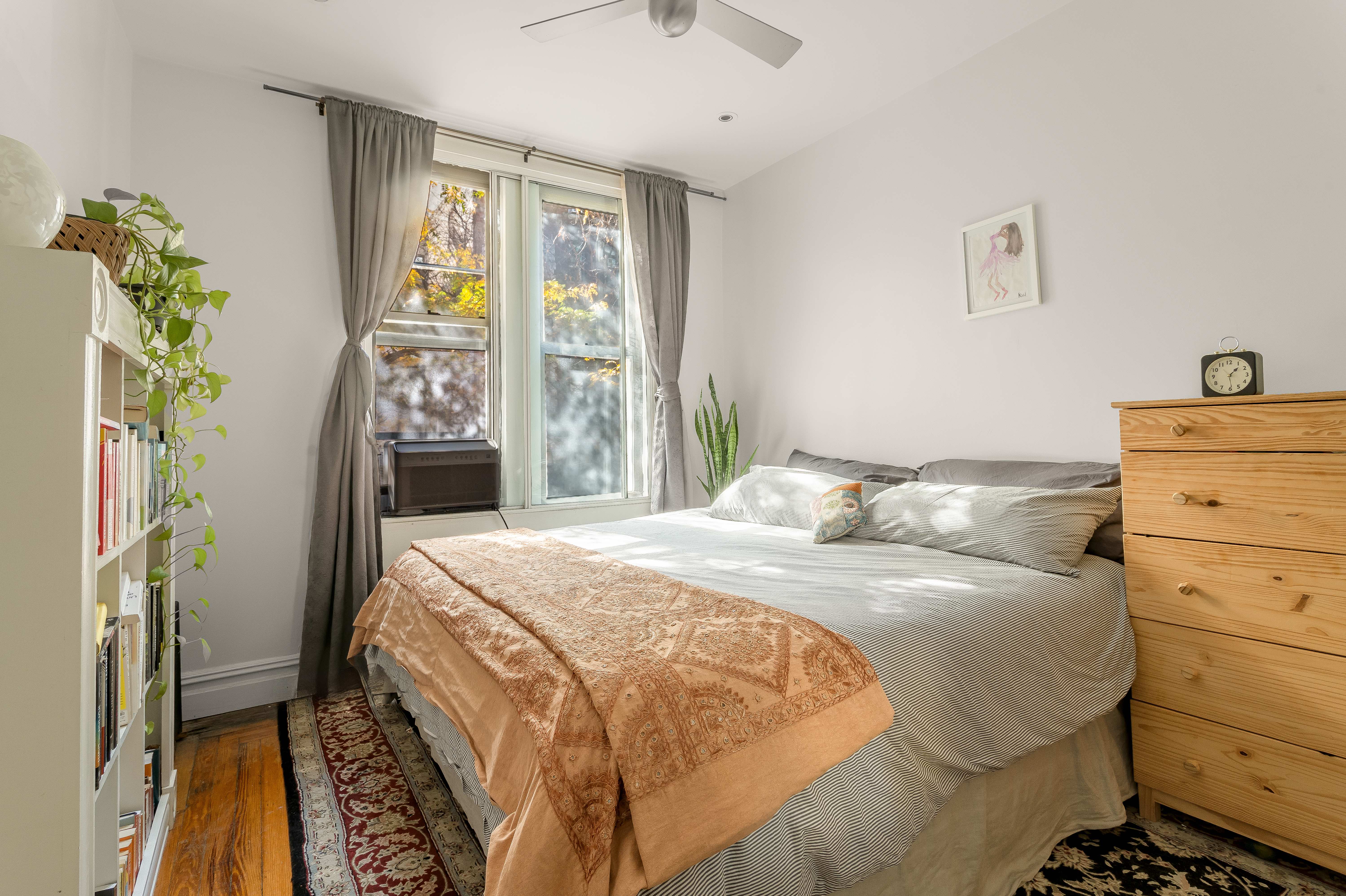 501 West 122nd Street, Unit A2 Manhattan, NY 10027 - Photo 7 of 21 a bedroom with a bed and a window