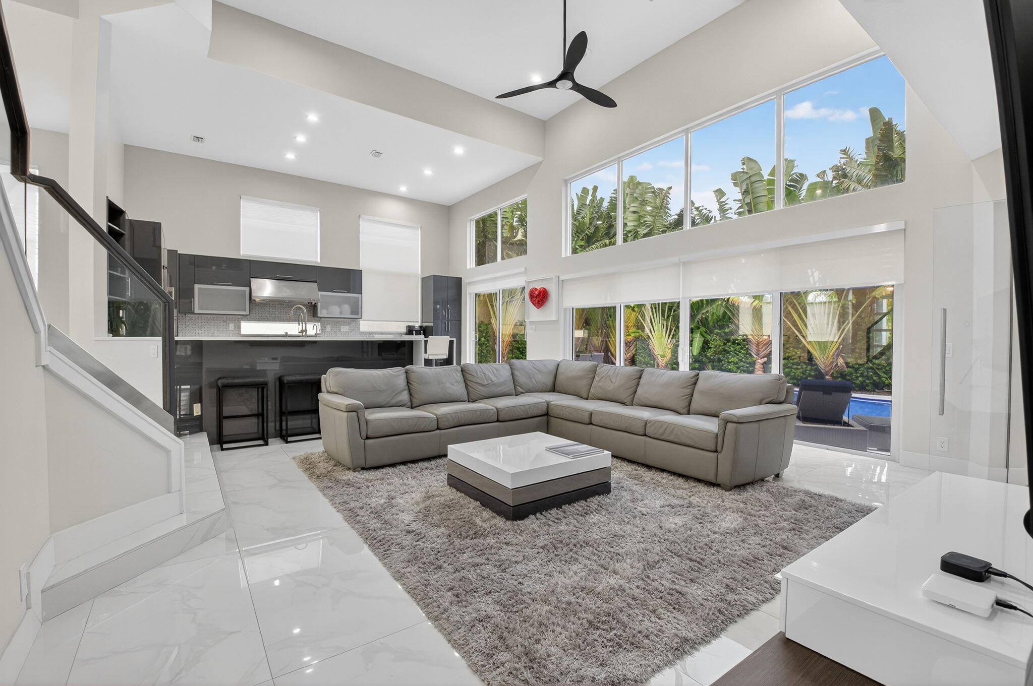 6529 Somerset Circle Boca Raton, FL 33496 - Photo 13 of 75 a living room with furniture and a large window