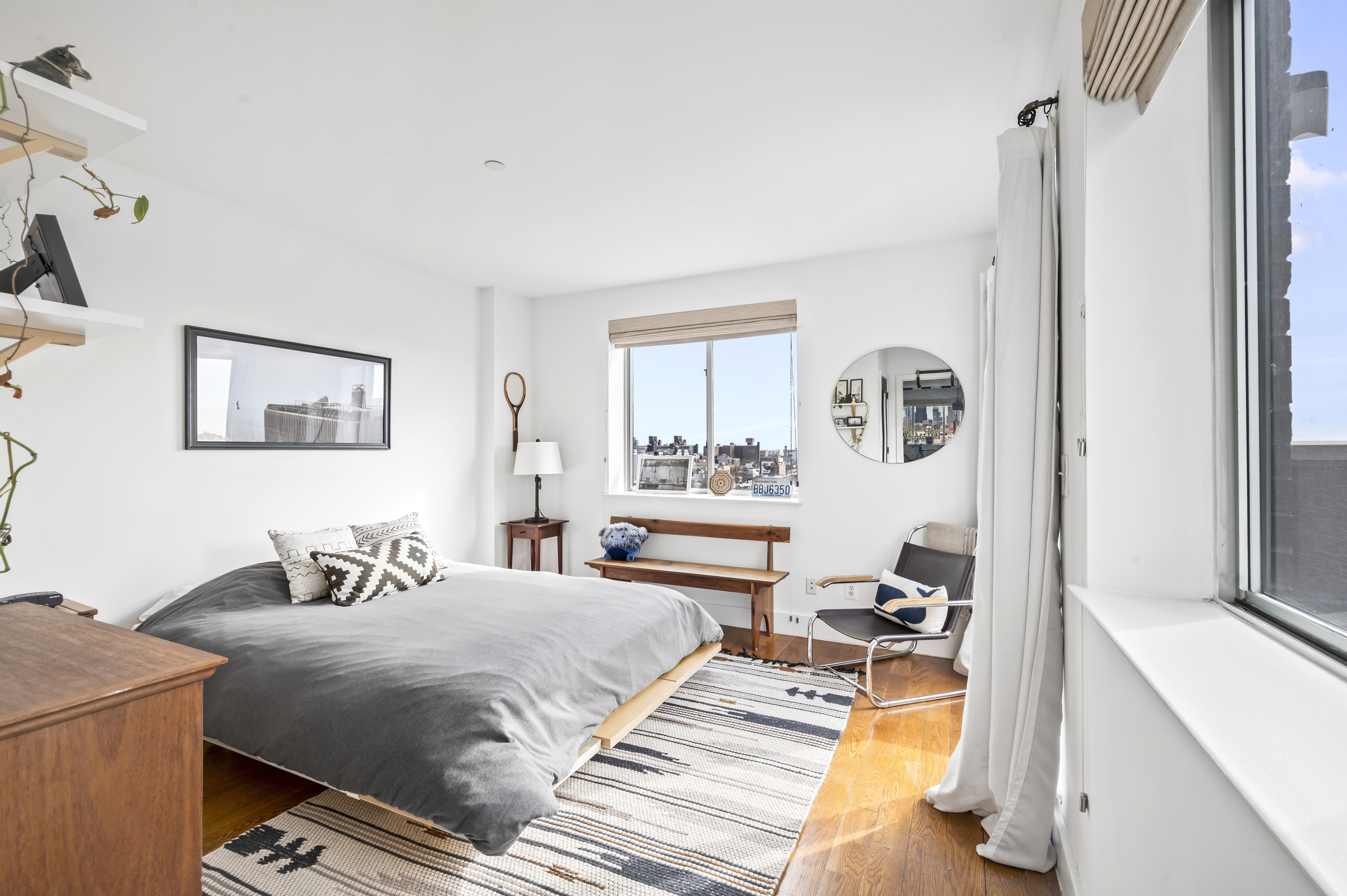 191 Spencer Street, Unit 9A Brooklyn, NY 11205 - Photo 7 of 10 a bedroom with a bed and a dresser next to a window