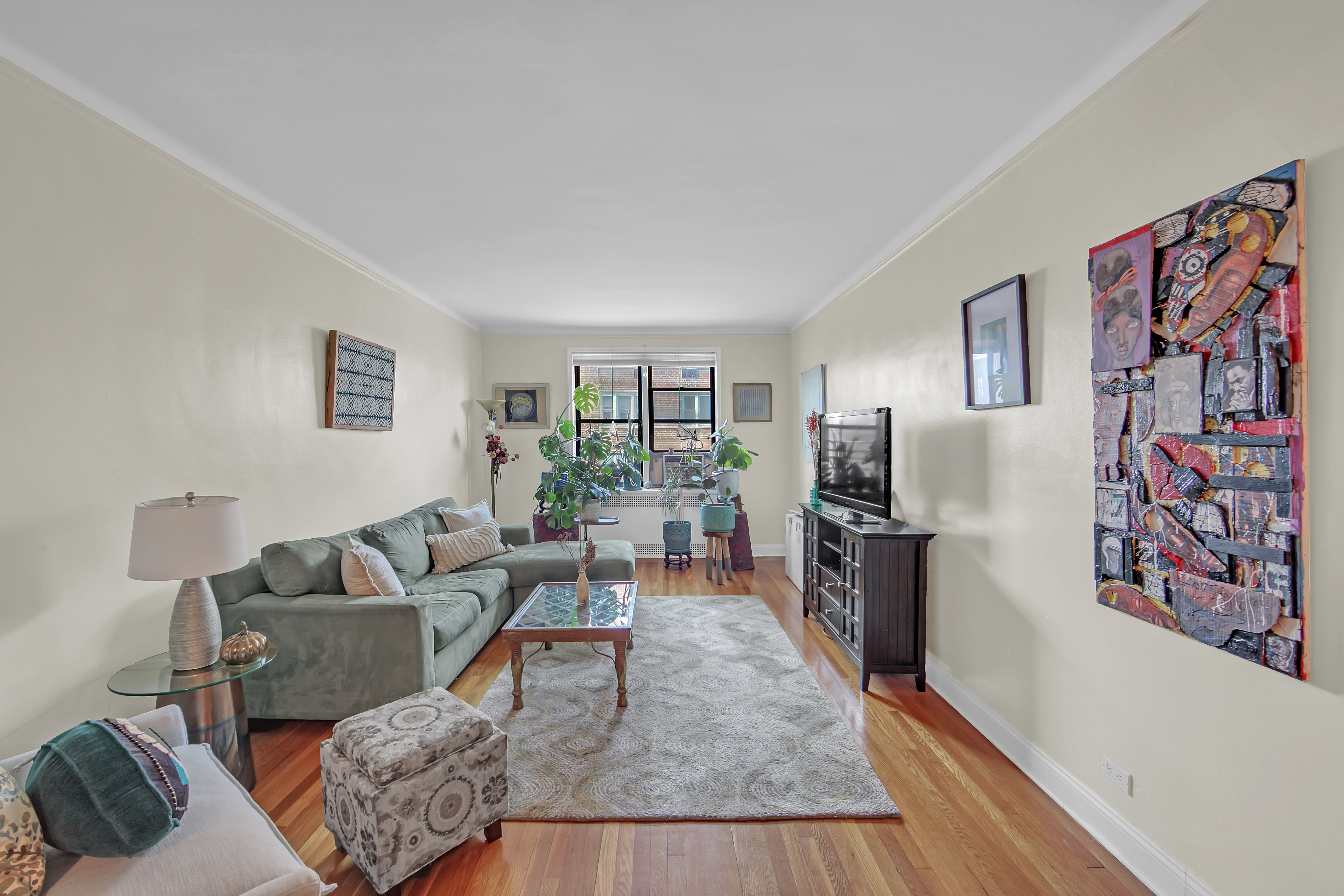 55 East 190th Street, Unit 59 Bronx, NY 10468 - Photo 4 of 14 a living room with furniture and a rug