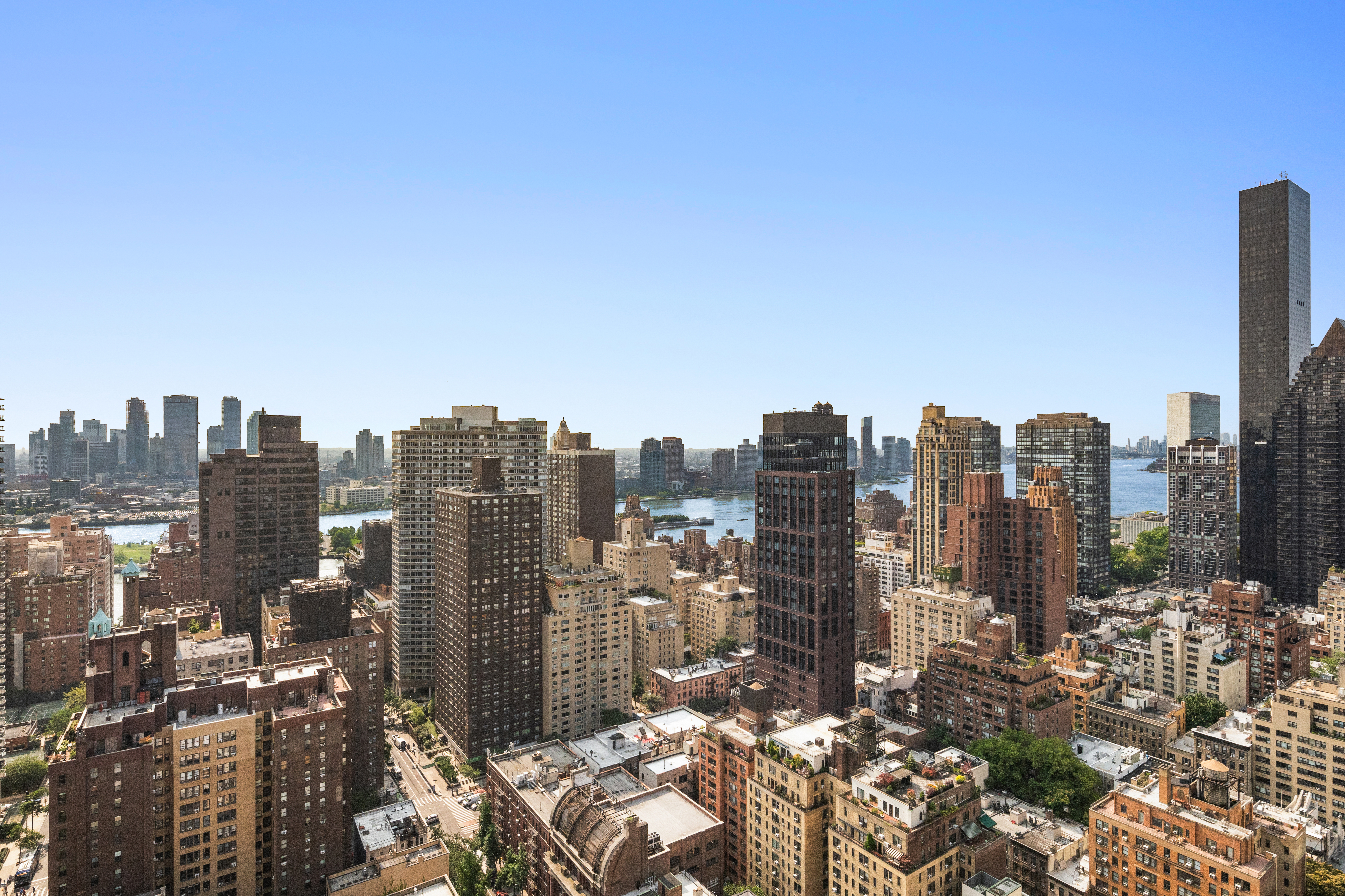 300 East 55th Street, Unit PHC Manhattan, NY 10022 - Photo 9 of 23 a view of a city with tall buildings