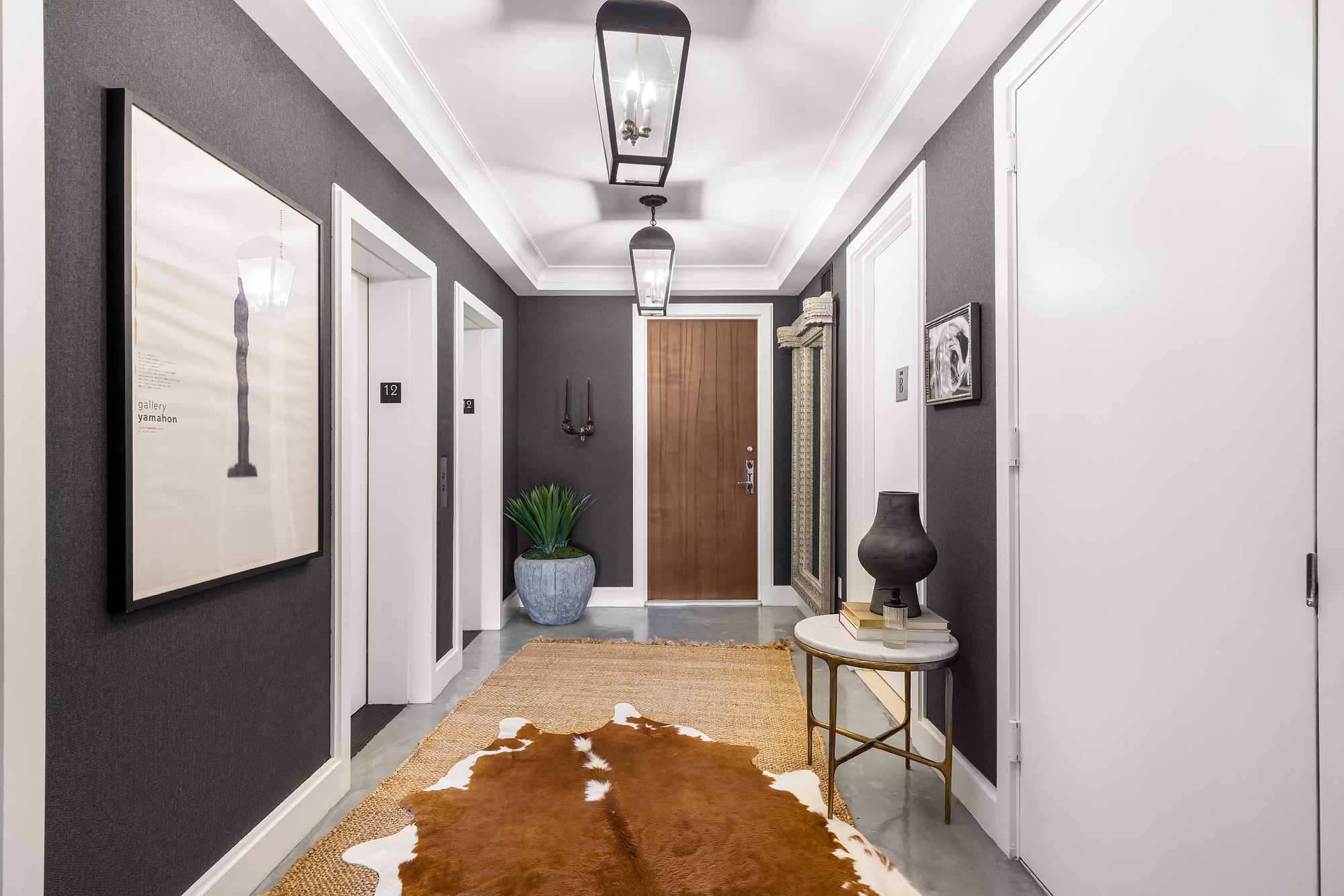 110 Central Park South, Unit 12ABC Manhattan, NY 10019 - Photo 41 of 49 a view of a hallway with furniture and front door