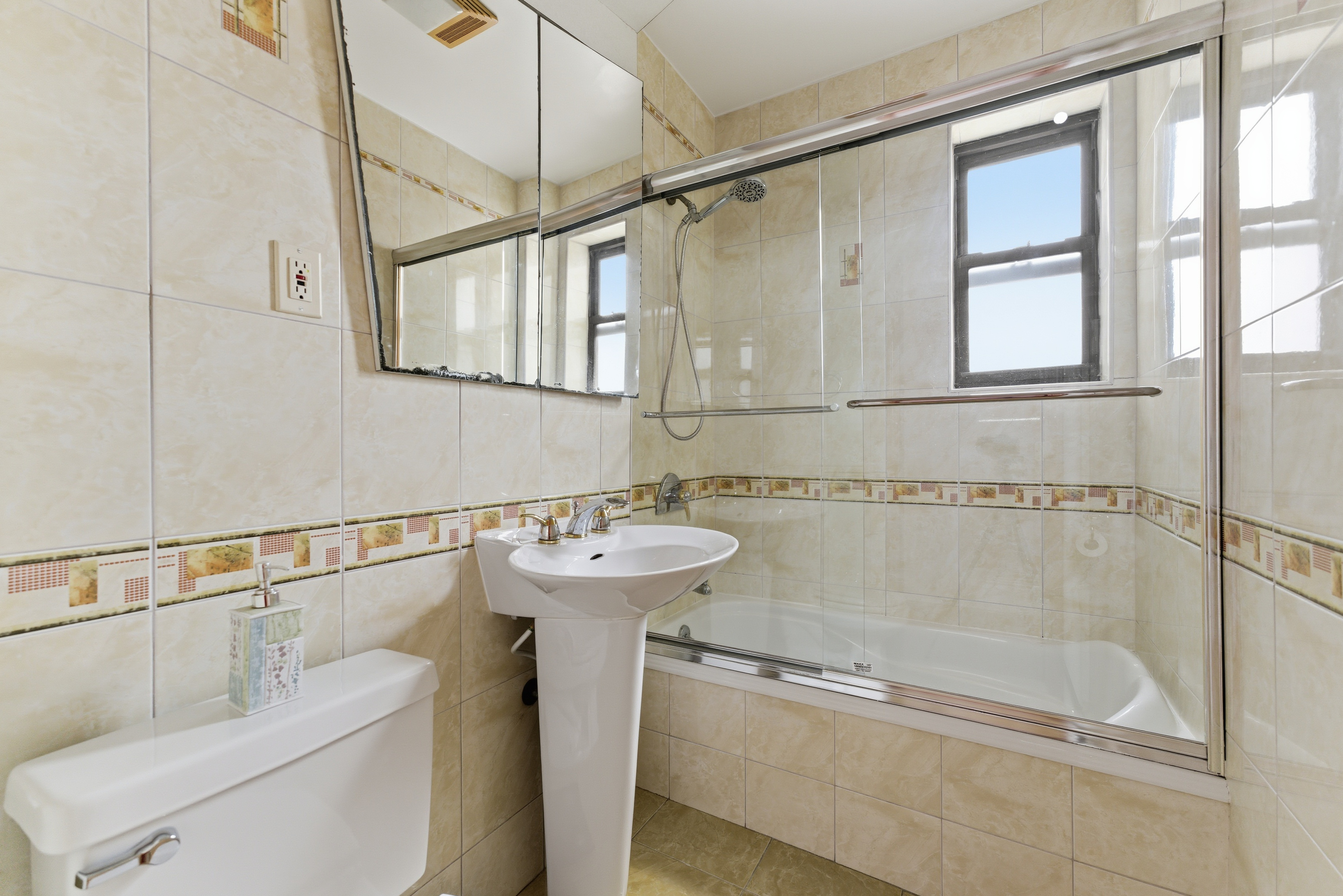 3616 Henry Hudson Parkway, Unit 7GN Bronx, NY 10463 - Photo 12 of 17 a bathroom with a sink a toilet and shower