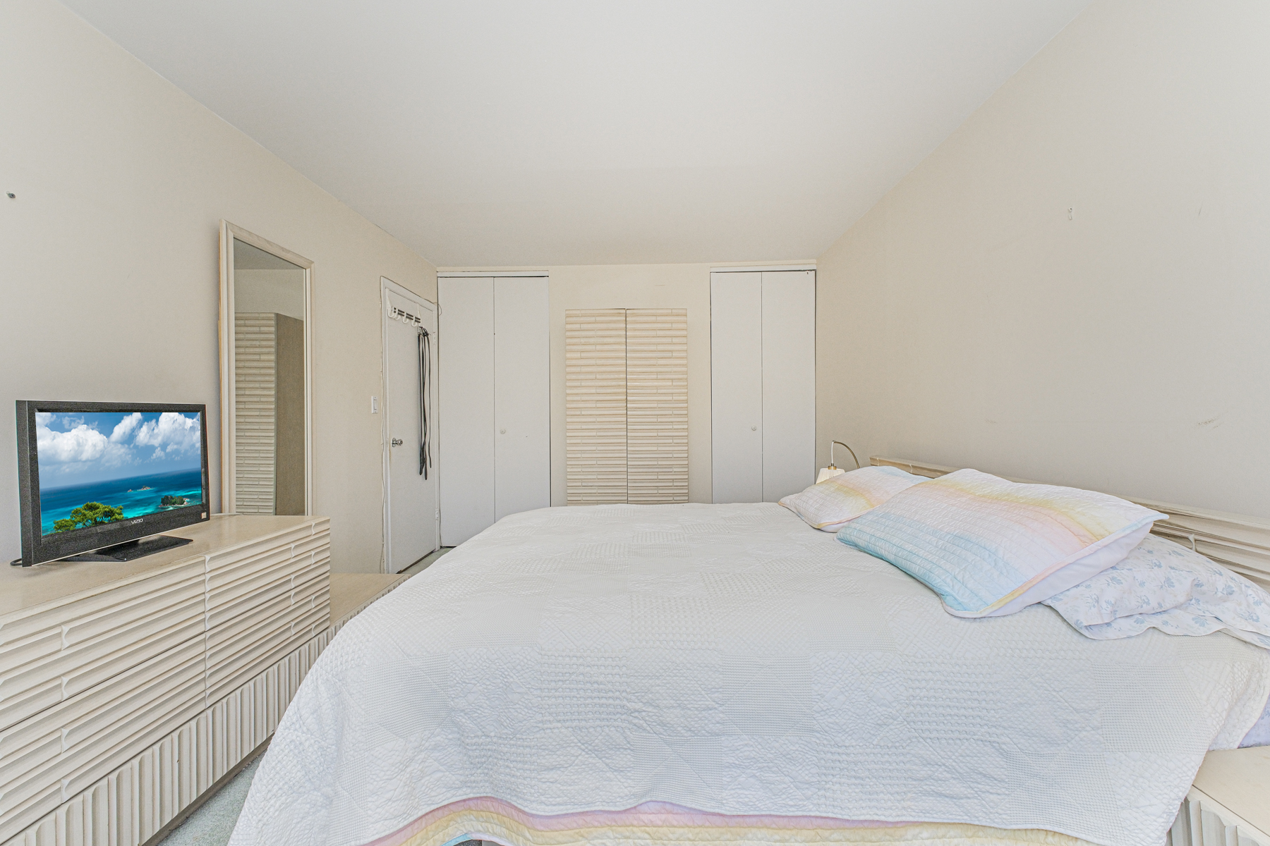 97 Dogwood Lane Staten Island, NY 10305 - Photo 8 of 22 a bedroom with a bed and a flat screen tv