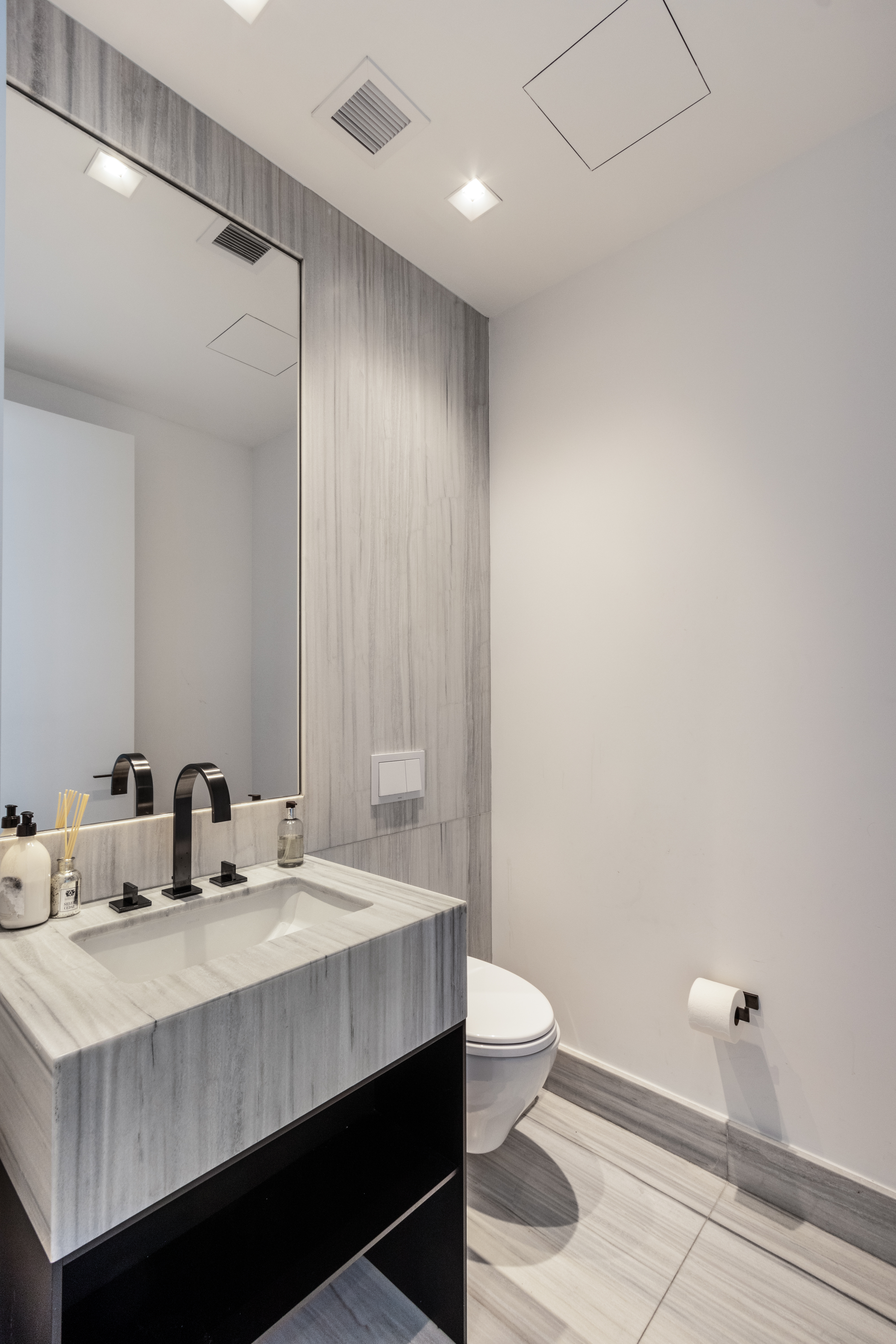 111 Murray Street, Unit 61W Manhattan, NY 10007 - Photo 26 of 35 a bathroom with a sink and a mirror