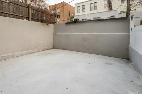a view of a city street with tall buildings