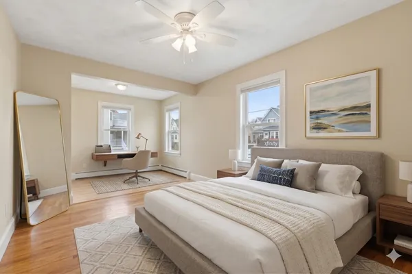 a bedroom with a large bed a chandelier and closet