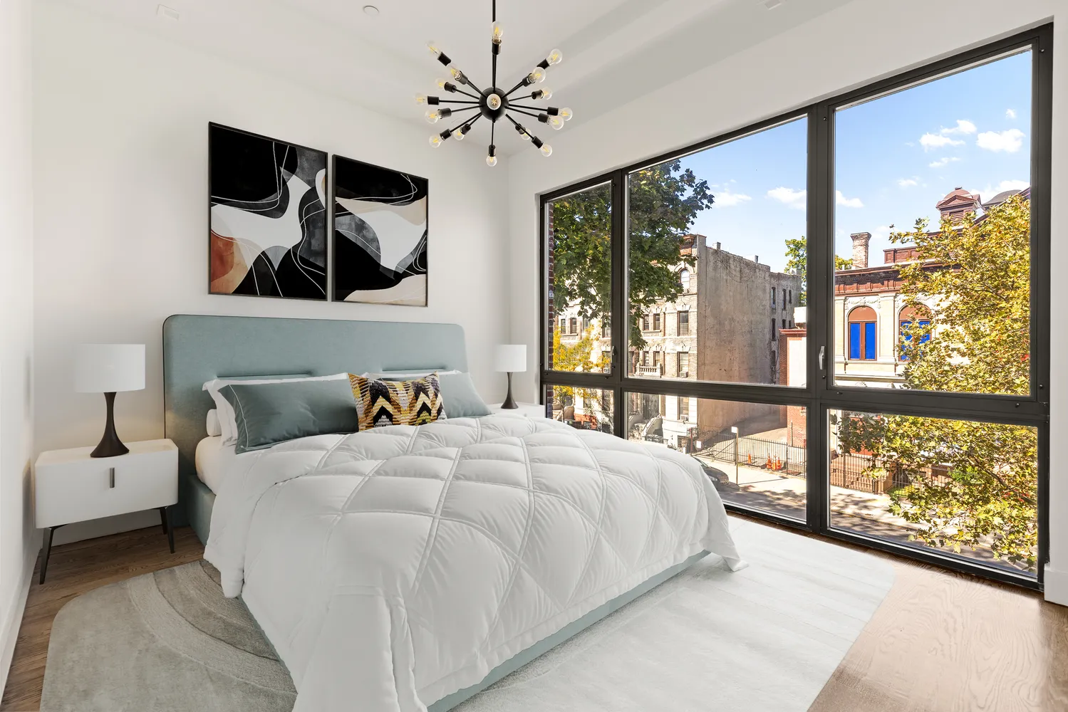 a bedroom with a large bed and a large window