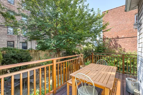 a view of a patio with wooden floor