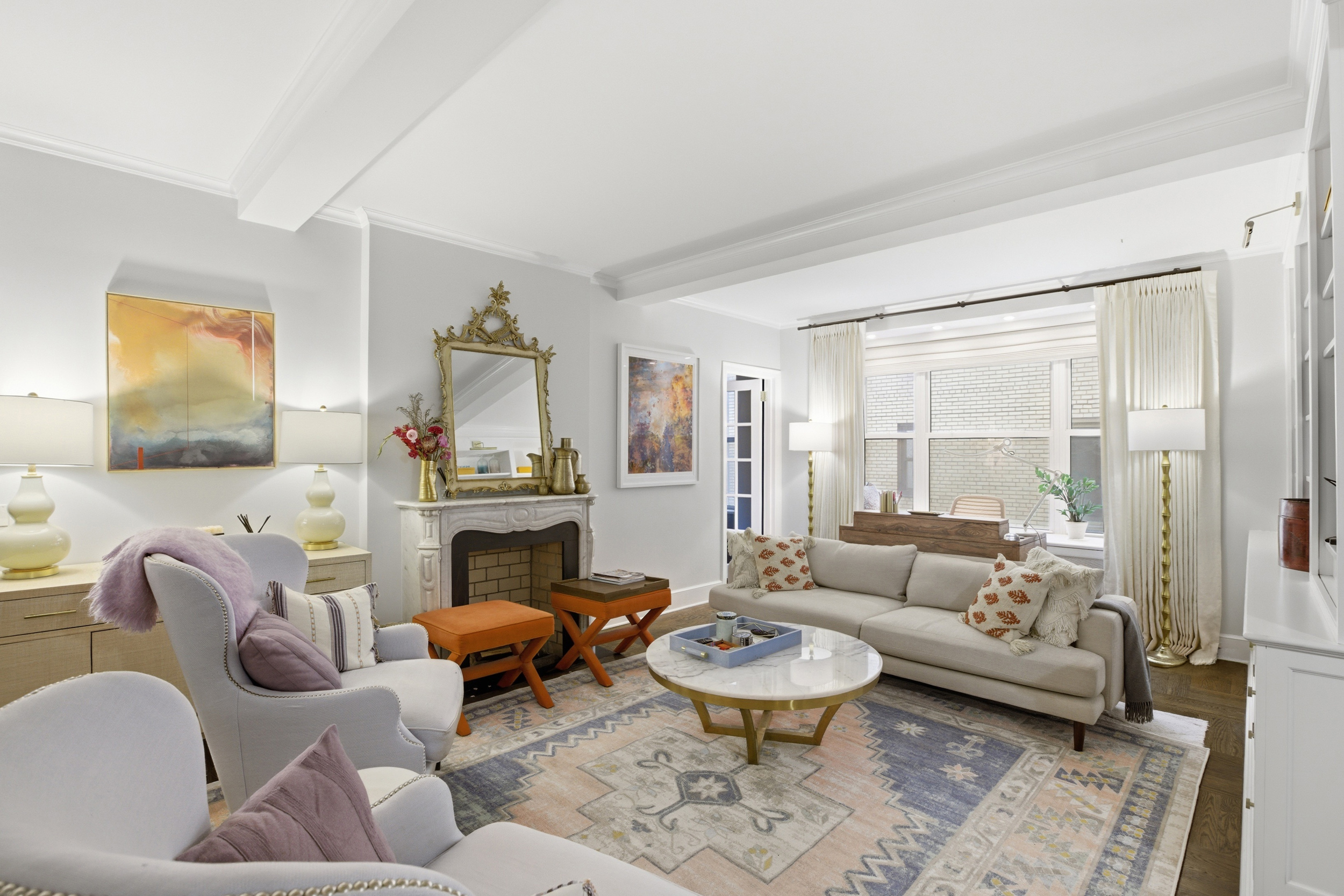 60 Gramercy Park North, Unit 8D Manhattan, NY 10010 - Photo 2 of 14 a living room with furniture and a fireplace