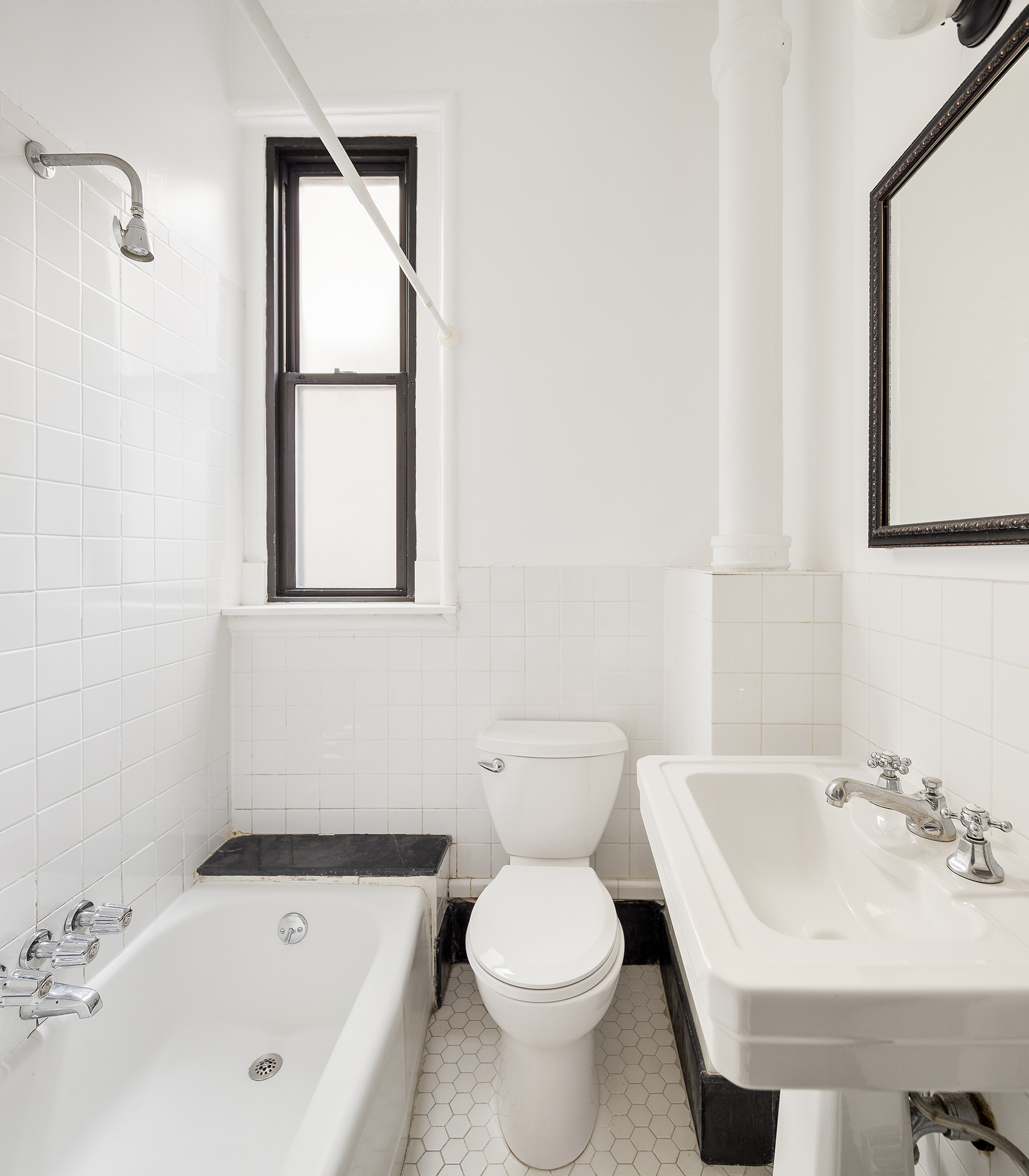 223 West 21st Street, Unit 5M Manhattan, NY 10011 - Photo 7 of 9 a bathroom with a sink and a bathtub