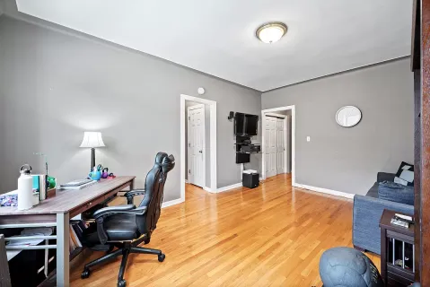 a room with furniture and a wooden floor