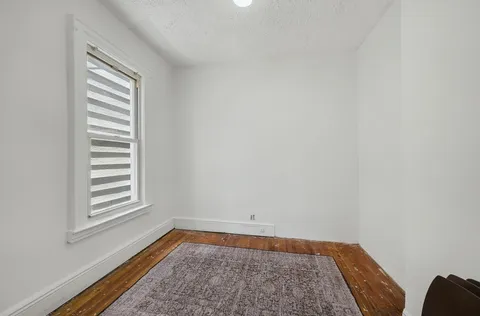 a view of room with window and carpet