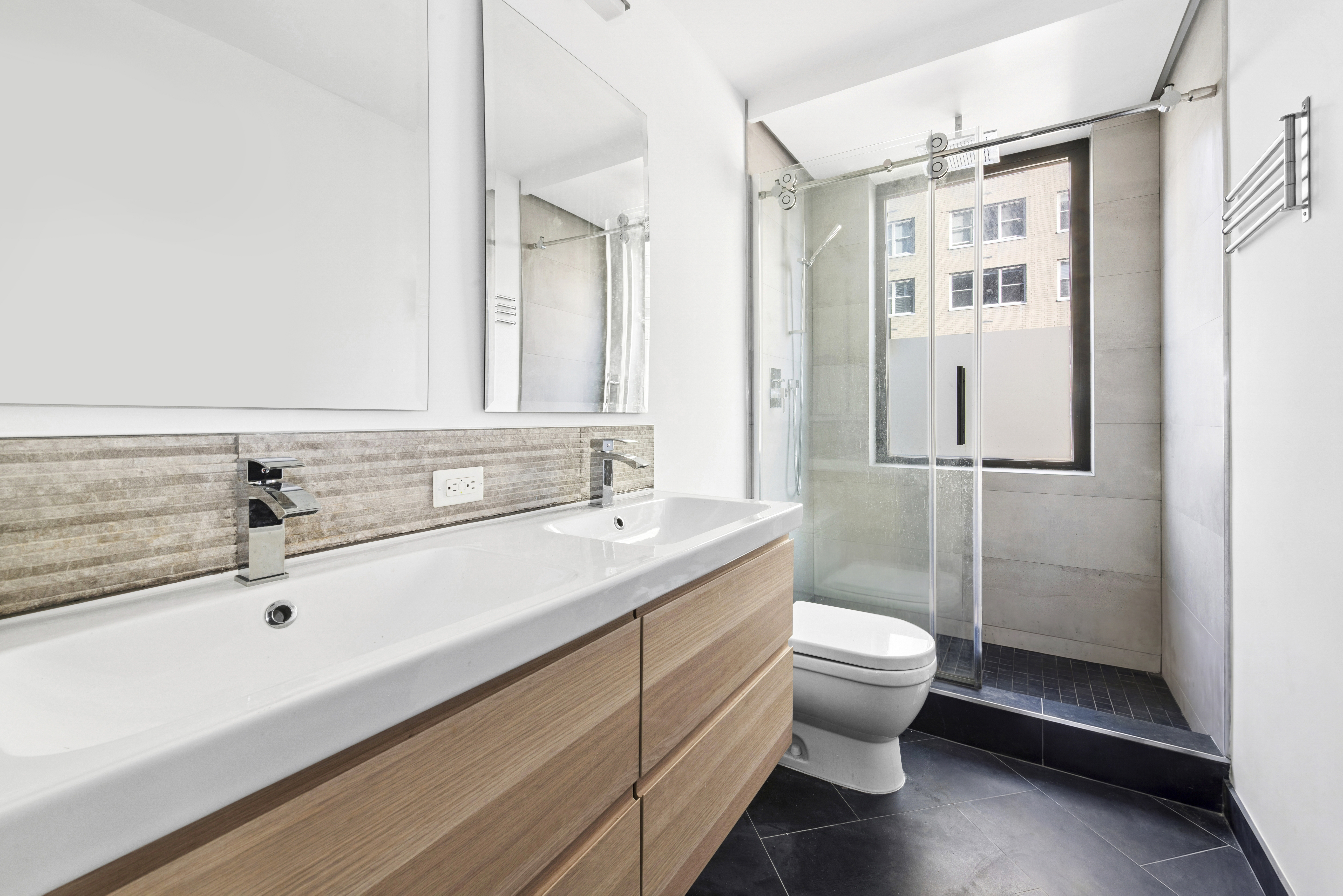 330 East 75th Street, Unit 5B Manhattan, NY 10021 - Photo 7 of 11 a bathroom with a sink a toilet and shower