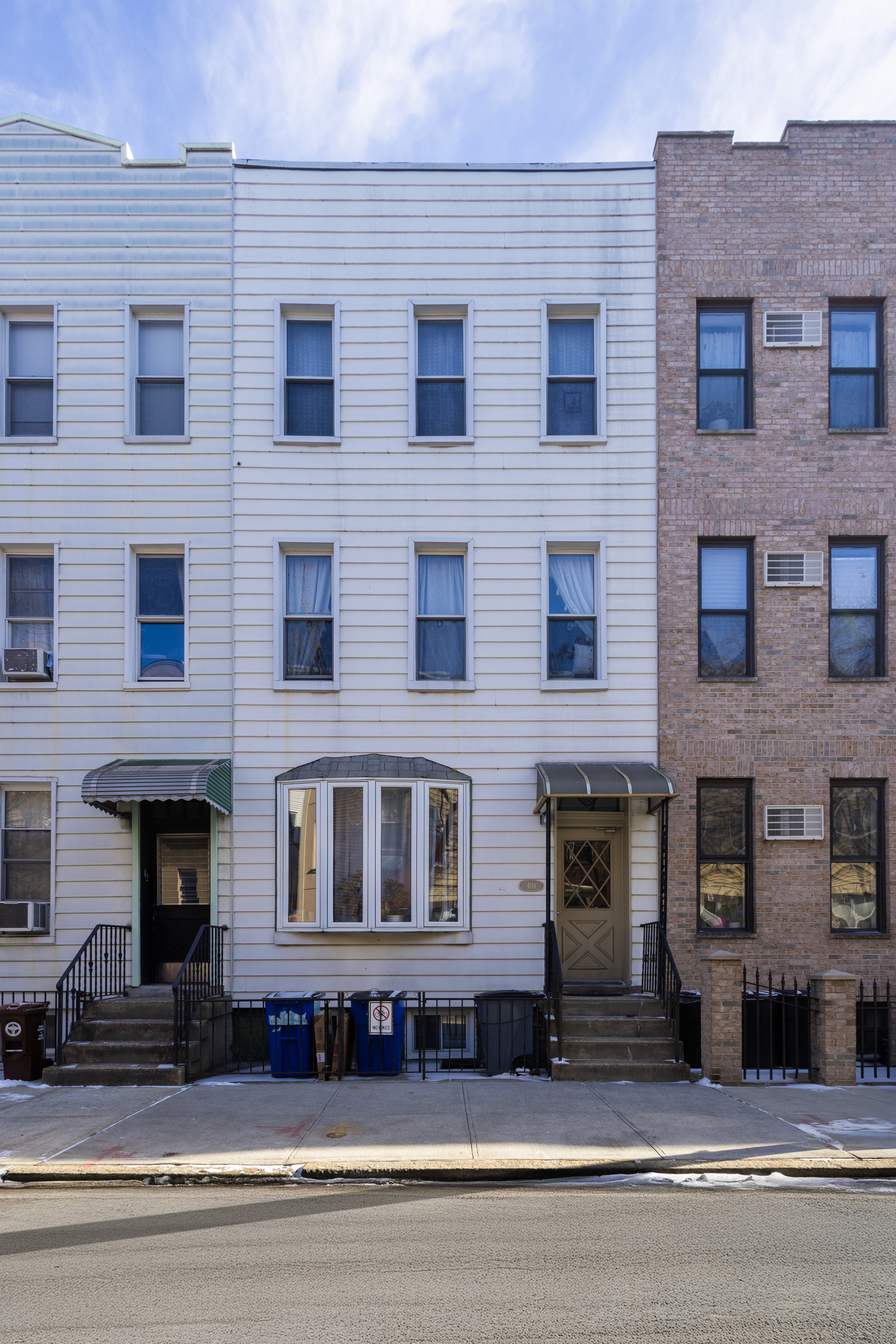 a bricked building that has a four windows