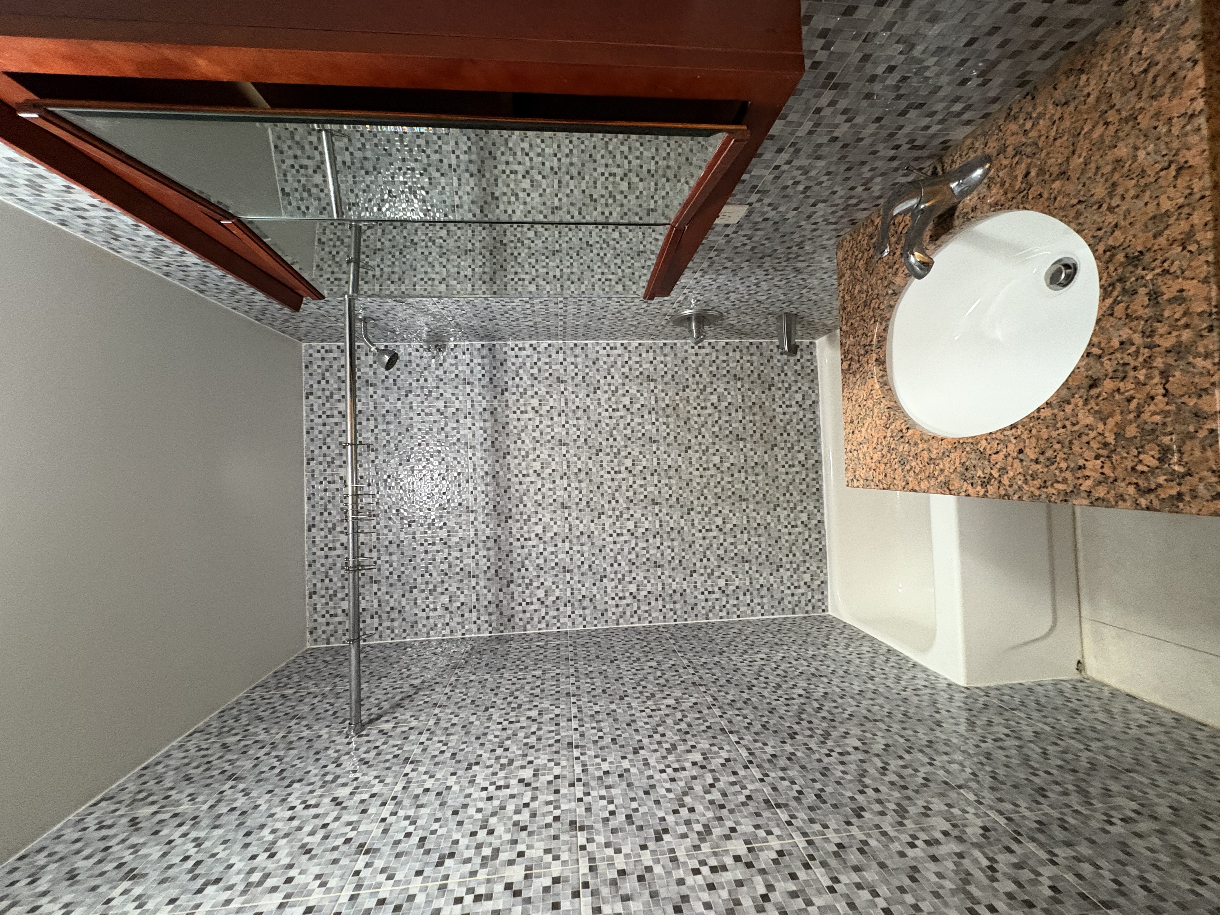 38 Ludlow Street, Unit 15 Manhattan, NY 10002 - Photo 16 of 16 a bathroom with a sink toilet and shower