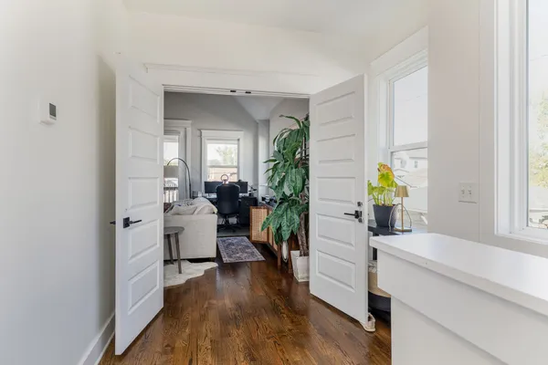 a bedroom with furniture and a book shelf