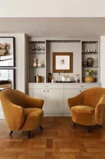 a living room with a couch and a large window