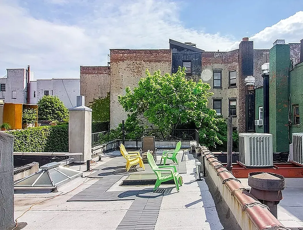 249 East Houston Street, Unit 4 Manhattan, NY 10002 - Photo 8 of 10 a view of a patio with couches table and chairs potted plants
