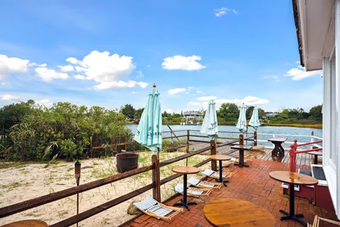 a view of swimming pool with outdoor seating