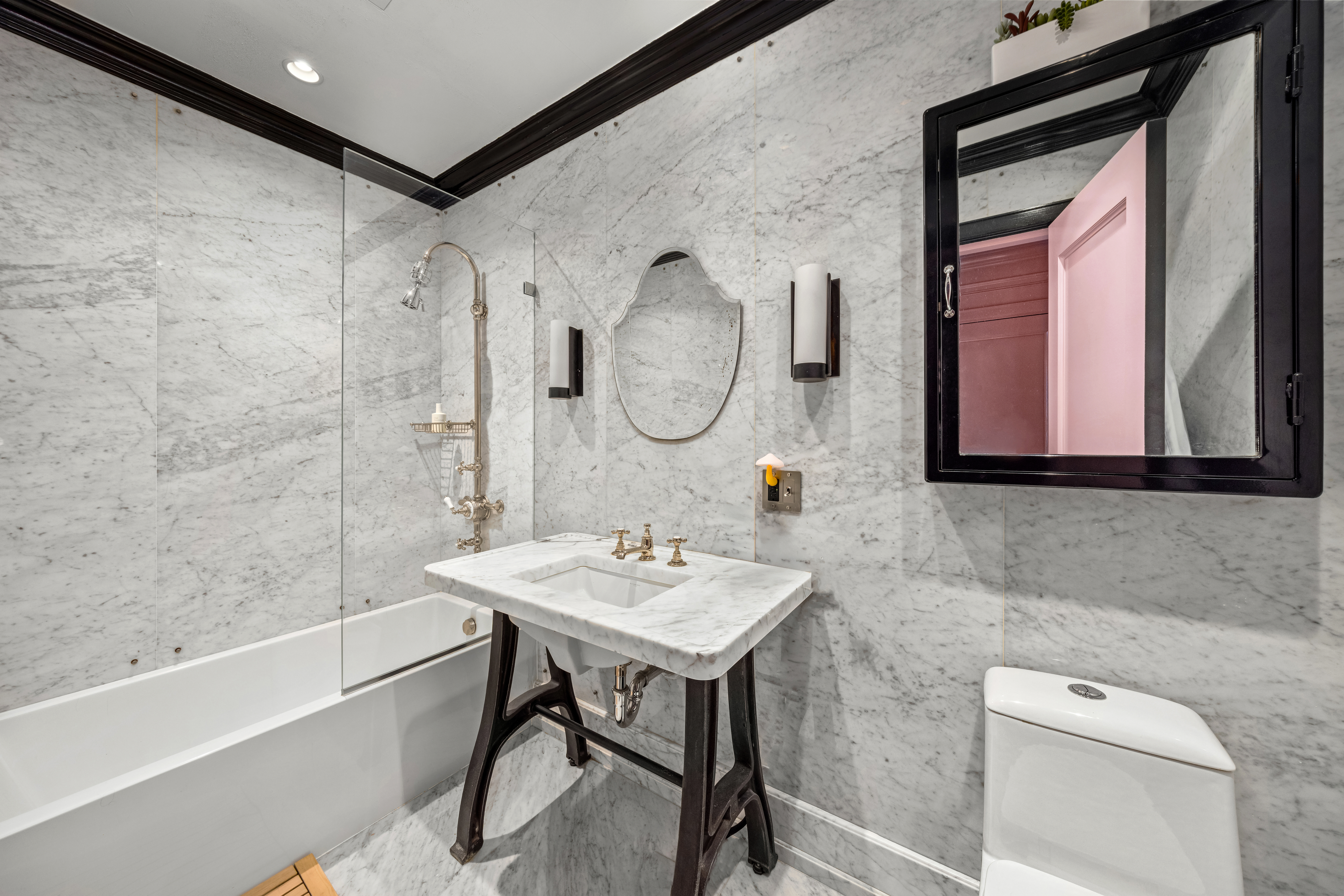 25 Prince Street, Unit 2A Manhattan, NY 10012 - Photo 13 of 16 a bathroom with a sink vanity tub and a mirror