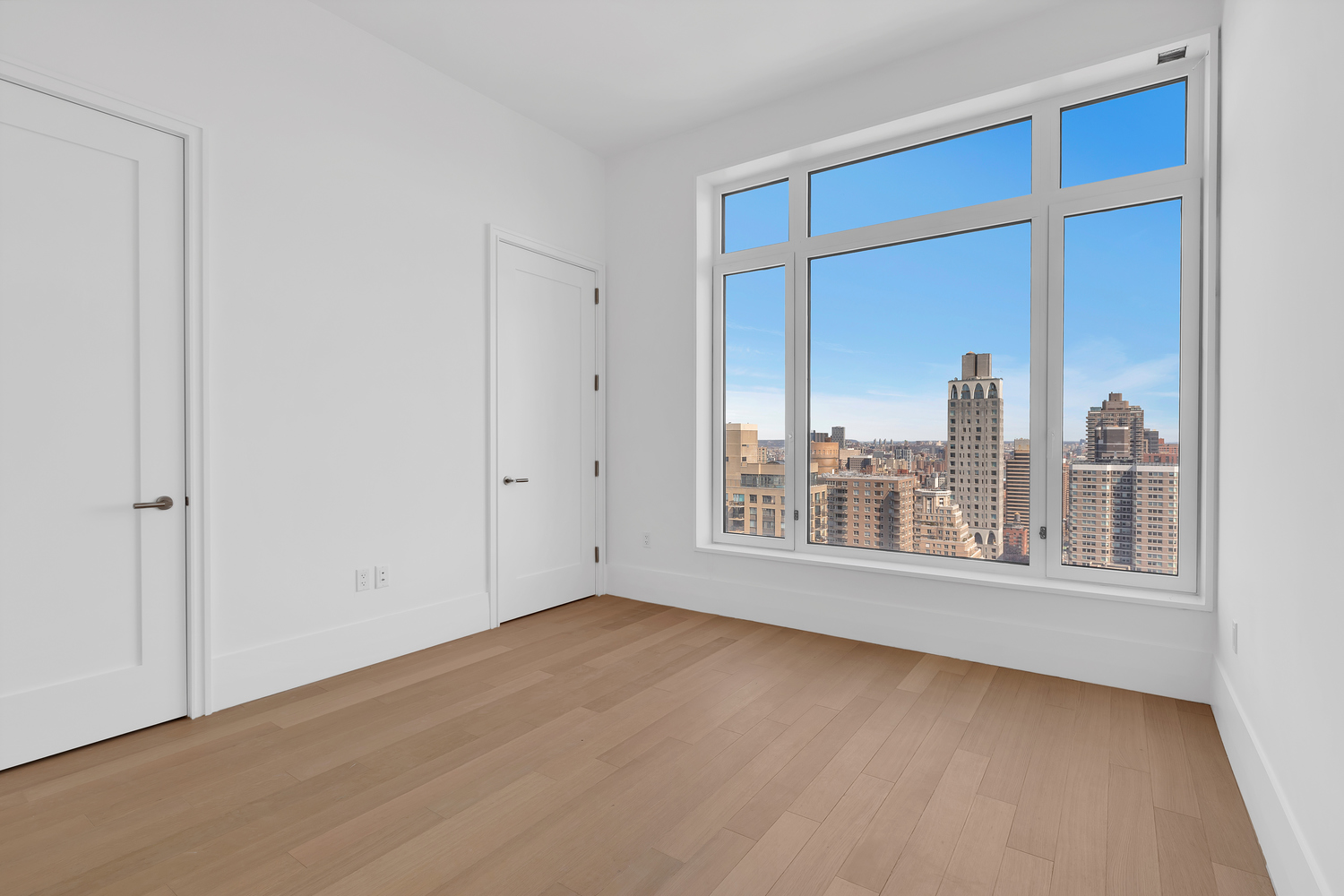 200 East 83rd Street, Unit 34A Manhattan, NY 10028 - Photo 18 of 34 a view of an empty room with a window
