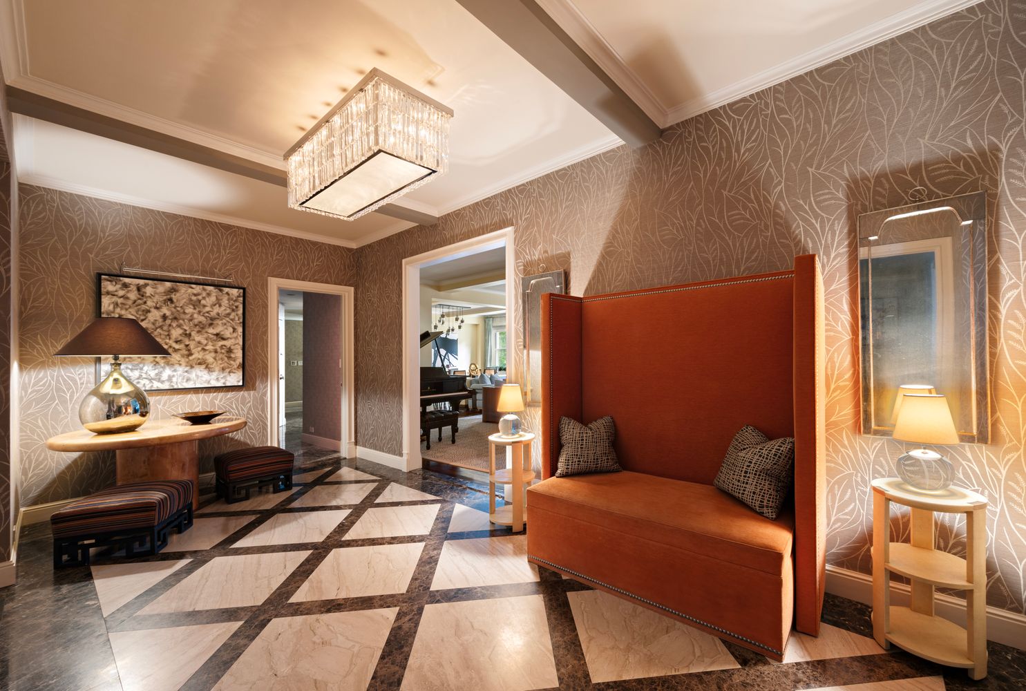 a living room with furniture a rug and a chandelier