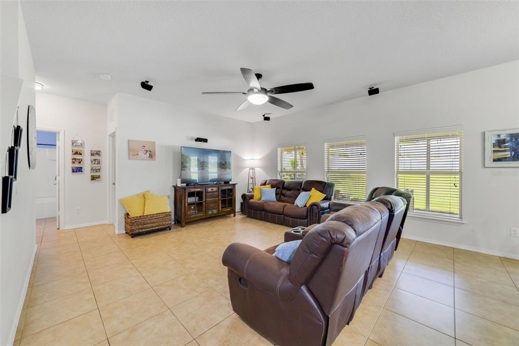 352 Giovani Boulevard Clermont, FL 34715 - Photo 14 of 46 a living room with furniture and a wooden floor