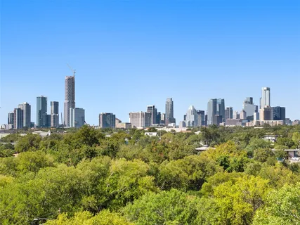 a view of a city with tall buildings in the background