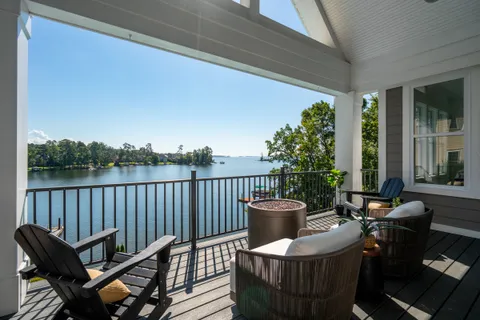 a view of a bedroom with furniture and windows